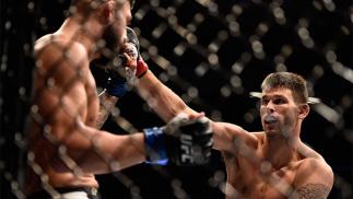 AUGUST 20: Tim Means fights Sabah Homasi in their welterweight bout during the UFC 202 event at T-Mobile Arena on August 20, 2016 in Las Vegas, Nevada. (Photo by Jeff Bottari/Zuffa LLC/Zuffa LLC via Getty Images)