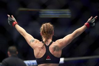 Valentina Shevchenko of Kyrgyzstan celebrates her TKO victory over Katlyn Chookagian in their women's flyweight championship bout during the UFC 247