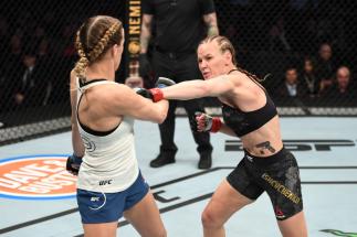 HOUSTON, TEXAS - FEBRUARY 08: (R-L) Valentina Shevchenko of Kyrgyzstan punches Katlyn Chookagian in their women's flyweight championship