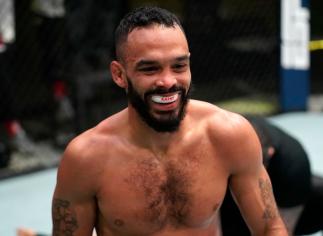 Rob Font celebrates after his victory over Marlon Moraes of Brazil in a bantamweight fight during the UFC Fight Night event at UFC APEX on December 19, 2020 in Las Vegas, Nevada. (Photo by Cooper Neill/Zuffa LLC)