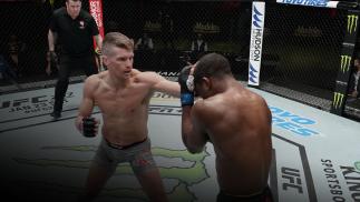 Stephen Thompson punches Geoff Neal in a welterweight fight during the UFC Fight Night event at UFC APEX on December 19, 2020 in Las Vegas, Nevada. (Photo by Cooper Neill/Zuffa LLC)
