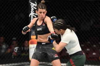 PHILADELPHIA, PA - MARCH 30: (L-R) Marina Rodriguez of Brazil punches Jessica Aguilar in their women's strawweight bout during the UFC Fight Night
