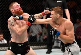 AUCKLAND, NEW ZEALAND - FEBRUARY 23: (R-L) Dan Hooker of New Zealand punches Paul Felder in their lightweight during the UFC Fight Night