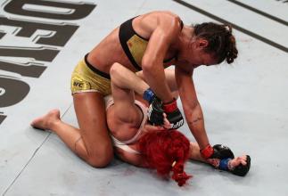 UFC Fight Night: Ribas v Markos BRASILIA, BRAZIL - MARCH 14: (L-R) Amanda Ribas of Brazil punches Randa Markos of Canada in their strawweight fight during the UFC Fight Night