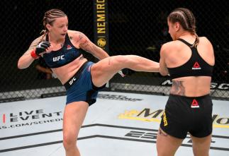 LAS VEGAS, NEVADA - AUGUST 01: (L-R) Joanne Calderwood of Scotland kicks Jennifer Maia of Brazil in their flyweight fight during the UFC Fight Night