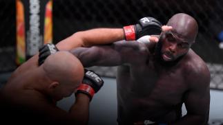Jairzinho Rozenstruik of Suriname punches Junior Dos Santos of Brazil in their heavyweight bout during the UFC 252 event at UFC APEX on August 15, 2020 in Las Vegas, Nevada. (Photo by Chris Unger/Zuffa LLC)