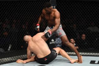 PHOENIX, ARIZONA - FEBRUARY 17: Francis Ngannou of Cameroon knocks down Cain Velasquez in their heavyweight bout during the UFC Fight Night event