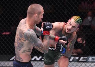 LAS VEGAS, NEVADA - JUNE 06: (R-L) Sean O'Malley punches Eddie Wineland in their bantamweight bout during the UFC 250 event at UFC APEX