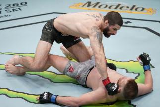 Matthew Semelsberger punches Jason Witt in a welterweight fight during the UFC Fight Night event at UFC APEX