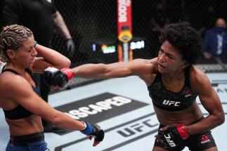 LAS VEGAS, NEVADA - MARCH 13: (R-L) Angela Hill punches Ashley Yoder in a strawweight fight during the UFC Fight Night event at UFC APEX