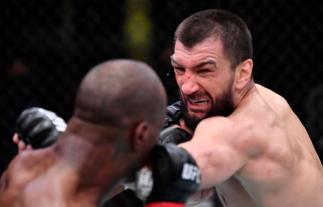 LAS VEGAS, NEVADA - MARCH 27: (R-L) Abubakar Nurmagomedov of Russia punches Jared Gooden in their welterweight fight during the UFC 260