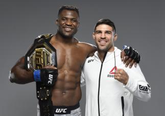 rancis Ngannou of Cameroon poses for a portrait with Vicente Luque after their victories during the UFC 260 event at UFC APEX
