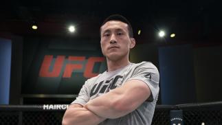 Song Kenan Poses In The Octagon At The UFC Apex, March 17, 2021 (Photo By Nolan Walker/Zuffa LLC)