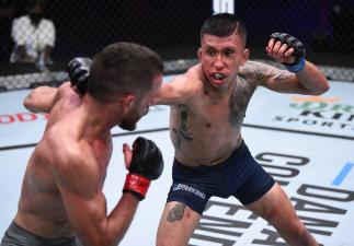 LAS VEGAS, NEVADA - AUGUST 25: (R-L) Jeffrey Molina punches Jacob Silva in a flyweight bout during week four of Dana White's Contender Series