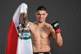 JACKSONVILLE, FLORIDA - APRIL 24: Kazula Vargas of Mexico poses for a post fight portrait backstage during the UFC 261
