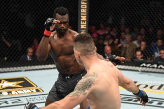 JACKSONVILLE, FLORIDA - APRIL 24: (R-L) Chris Weidman kicks Uriah Hall of Jamaica in their middleweight bout during the UFC 261