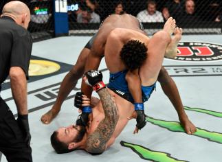 Paul Craig of Scotland elbows Jamahal Hill while in a triangle choke in their light heavyweight fight during the UFC 263 event at Gila River Arena on June 12, 2021 in Glendale, Arizona. (Photo by Jeff Bottari/Zuffa LLC)