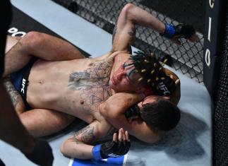 Mickey Gall secures a rear choke submission against Jordan Williams in their welterweight fight during the UFC Fight Night event at UFC APEX on July 24 2021 in Las Vegas Nevada.