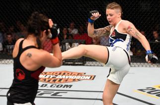 OTTAWA, ON - JUNE 18: (R-L) Joanne Calderwood of Scotland kicks Valerie Letourneau of Canada in their women's flyweight bout during the UFC Fight Night event inside the TD Place Arena on June 18, 2016 in Ottawa, Ontario, Canada. (Photo by Jeff Bottari/Z