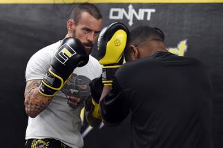 MILWAUKEE, WI - AUGUST 29: CM Punk (L) spars with Mike "Biggie" Rhodes (R) during a training session at Roufusport Martial Arts Academy on August 29, 2016 in Milwaukee, Wisconsin. (Photo by Stacy Revere/ Zuffa LLC/Zuffa LLC via Getty Images)