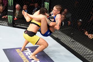 CLEVELAND, OH - SEPTEMBER 10: (L-R) Jessica Andrade of Brazil takes down Joanne Calderwood of Scotland in their strawweight bout during the UFC 203 event at Quicken Loans Arena on September 10, 2016 in Cleveland, Ohio. (Photo by Josh Hedges/Zuffa LLC/Zuf
