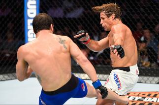 CLEVELAND, OH - SEPTEMBER 10: (L-R) Jimmie Rivera lands a kick to the leg of Urijah Faber in their bantamweight bout during the UFC 203 event at Quicken Loans Arena on September 10, 2016 in Cleveland, Ohio. (Photo by Josh Hedges/Zuffa LLC/Zuffa LLC via G