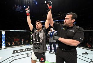 NEW YORK, NY - NOVEMBER 12: Vicente Luque of Brazil celebrates his win by TKO over Belal Muhammad of the United States in their welterweight bout during the UFC 205 event at Madison Square Garden on November 12, 2016 in New York City. (Photo by Al Bello