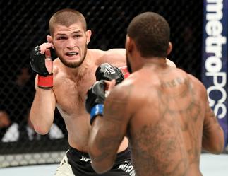 NEW YORK, NY - NOVEMBER 12: Michael Johnson of the United States (right) fights against Khabib Nurmagomedov of Russia in their lightweight bout during the UFC 205 event at Madison Square Garden on November 12, 2016 in New York City. (Photo by Jeff Botta