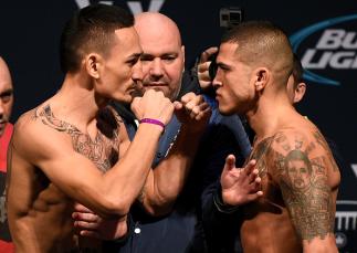 TORONTO, CANADA - DECEMBER 09: Opponents (L-R) Max Holloway and Anthony Pettis face off during the UFC weigh-in at Air Canada Centre on December 9, 2016 in Toronto, Ontario, Canada. (Photo by Jeff Bottari/Zuffa LLC/Zuffa LLC via Getty Images)
