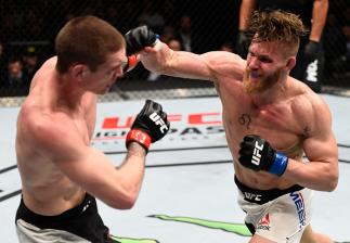 TORONTO, CANADA - DECEMBER 10: (R-L) Emil Meek of Norway punches Jordan Mein of Canada in their welterweight bout during the UFC 206 event inside the Air Canada Centre on December 10, 2016 in Toronto, Ontario, Canada. (Photo by Jeff Bottari/Zuffa LLC/Zuf