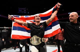 TORONTO, CANADA - DECEMBER 10: Max Holloway celebrates his TKO victory over Anthony Pettis in their interim UFC featherweight championship bout during the UFC 206 event inside the Air Canada Centre on December 10, 2016 in Toronto, Ontario, Canada. (Photo