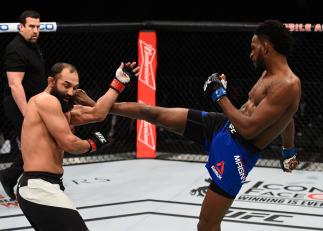 LAS VEGAS, NV - DECEMBER 30: (R-L) Neil Magny kicks Johny Hendricks in their welterweight bout during the UFC 207 event at T-Mobile Arena on December 30, 2016 in Las Vegas, Nevada. (Photo by Jeff Bottari/Zuffa LLC/Zuffa LLC via Getty Images)