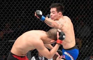 LAS VEGAS, NV - DECEMBER 30: (R-L) Ray Borg punches Louis Smolka in their flyweight bout during the UFC 207 event at T-Mobile Arena on December 30, 2016 in Las Vegas, Nevada. (Photo by Jeff Bottari/Zuffa LLC/Zuffa LLC via Getty Images)