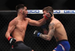 LAS VEGAS, NV - DECEMBER 30: (L-R) Dominick Cruz punches Cody Garbrandt in their UFC bantamweight championship bout during the UFC 207 event on December 30, 2016 in Las Vegas, Nevada. (Photo by Christian Petersen/Getty Images)