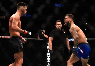 LAS VEGAS, NV - DECEMBER 30: (R-L) Cody Garbrandt taunts Dominick Cruz in their UFC bantamweight championship bout during the UFC 207 event at T-Mobile Arena on December 30, 2016 in Las Vegas, Nevada. (Photo by Jeff Bottari/Zuffa LLC/Zuffa LLC via Getty