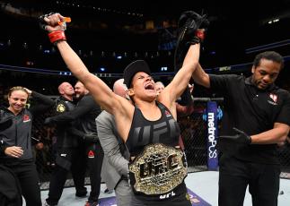 LAS VEGAS, NV - DECEMBER 30:  Amanda Nunes of Brazil reacts to her victory over Ronda Rousey in their UFC women's bantamweight championship bout during the UFC 207 event at T-Mobile Arena on December 30, 2016 in Las Vegas, Nevada.  (Photo by Josh Hedges/Z