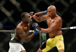 NEW YORK, NY - FEBRUARY 11: Anderson Silva of Brazil (R) exchanges punches with Derek Brunson (L) of United States in their middleweight bout during UFC 208 at the Barclays Center on February 11, 2017 in the Brooklyn Borough of New York City. (Photo by