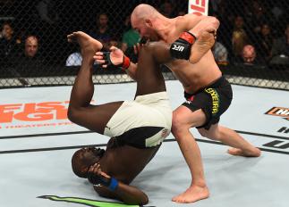 BROOKLYN, NEW YORK - FEBRUARY 11: (R-L) Glover Teixeira of Brazil controls the body of Jared Cannonier in their light heavyweight bout during the UFC 208 event inside Barclays Center on February 11, 2017 in Brooklyn, New York. (Photo by Jeff Bottari/Zuff