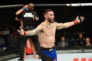BUFFALO, NY - APRIL 08: The referee stops the fight as Shane Burgos celebrates his technical knockout victory over Charles Rosa in their featherweight bout during the UFC 210 event at KeyBank Center on April 8, 2017 in Buffalo, New York. (Photo by Josh