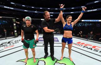 DALLAS, TX - MAY 13: (R-L) Cortney Casey celebrates her victory over Jessica Aguilar in their women's strawweight fight during the UFC 211 event at the American Airlines Center on May 13, 2017 in Dallas, Texas. (Photo by Josh Hedges/Zuffa LLC/Zuffa LLC v