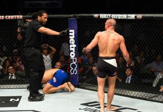 DALLAS, TX - MAY 13: (R-L) Eddie Alvarez is told to go to his corner after an illegal knee Dustin Poirier in their lightweight fight during the UFC 211 event at the American Airlines Center on May 13, 2017 in Dallas, Texas. (Photo by Josh Hedges/Zuffa LL