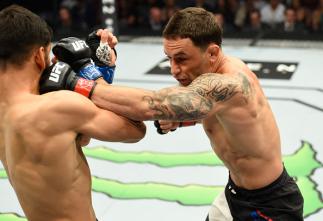 DALLAS, TX - MAY 13: (R-L) Frankie Edgar punches Yair Rodriguez in their featherweight fight during the UFC 211 event at the American Airlines Center on May 13, 2017 in Dallas, Texas. (Photo by Josh Hedges/Zuffa LLC/Zuffa LLC via Getty Images)