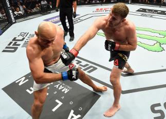 DALLAS, TX - MAY 13: (R-L) Stipe Miocic punches Junior Dos Santos in their UFC heavyweight championship fight during the UFC 211 event at the American Airlines Center on May 13, 2017 in Dallas, Texas. (Photo by Josh Hedges/Zuffa LLC/Zuffa LLC via Getty I