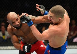 LAS VEGAS, NV - JULY 08: (L-R) Yoel Romero of Cuba punches Robert Whittaker of New Zealand in their interim UFC middleweight championship bout during the UFC 213 event at T-Mobile Arena on July 8, 2017 in Las Vegas, Nevada. (Photo by Josh Hedges/Zuffa L