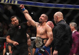 LAS VEGAS, NV - JULY 08: Robert Whittaker of New Zealand celebrates his victory over Yoel Romero of Cuba in their interim UFC middleweight championship bout during the UFC 213 event at T-Mobile Arena on July 8, 2017 in Las Vegas, Nevada. (Photo by Chris