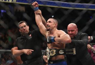 LAS VEGAS, NV - JULY 08: Robert Whittaker of New Zealand celebrates after his victory over Yoel Romero of Cuba in their interim UFC middleweight championship bout during the UFC 213 event at T-Mobile Arena on July 8, 2017 in Las Vegas, Nevada. (Photo by