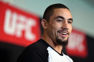 MELBOURNE, AUSTRALIA - NOVEMBER 25: Robert Whittaker of New Zealand interacts with the media during the UFC Fight Night Ultimate Media Day at the Melbourne Convention and Exhibition Centre on November 25, 2016 in Melbourne, Australia. (Photo by Jeff Bott