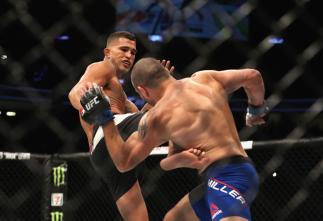 LAS VEGAS, NV - JULY 08: (L-R) Anthony Pettis kicks Jim Miller in their lightweight bout during the UFC 213 event at T-Mobile Arena on July 8, 2017 in Las Vegas, Nevada. (Photo by Christian Petersen/Zuffa LLC)
