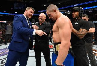 LAS VEGAS, NV - JULY 08: (L-R) UFC middleweight champion Michael Bisping challenges newly crowned interim UFC middleweight champion Robert Whittaker of New Zealand after his victory over Yoel Romero during the UFC 213 event at T-Mobile Arena on July 8, 2
