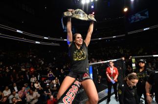 EDMONTON, AB - SEPTEMBER 09: Amanda Nunes of Brazil celebrates her victory over Valentina Shevchenko of Kyrgyzstan in their women's bantamweight bout during the UFC 215 event inside the Rogers Place on September 9, 2017 in Edmonton, Alberta, Canada. (Pho
